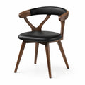 Chaise en bois noyer avec assise en cuir synthétique noir